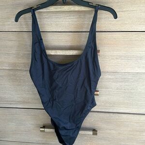 Never worn skins one piece bathing suit